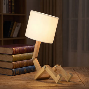 Rilna lamp glowing on a wooden desk