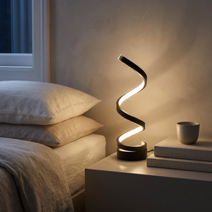 Leto lamp glowing on a bedside table