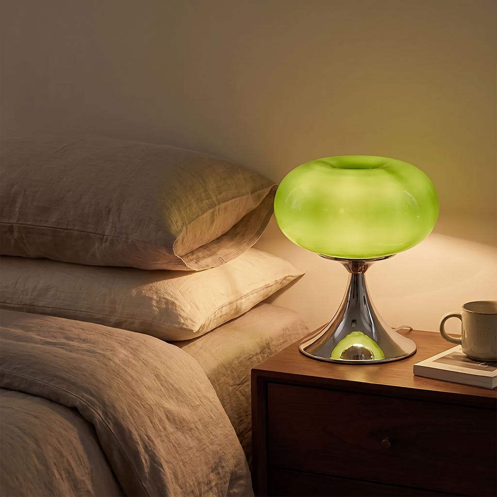 Louna lamp glowing on a bedside table